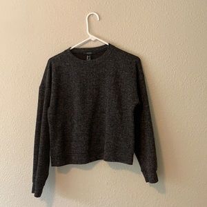 A black sweater crop top